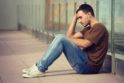 Restore Troubled Teens: Adolescent from Waukegan, IL sad exploring support from treatment program